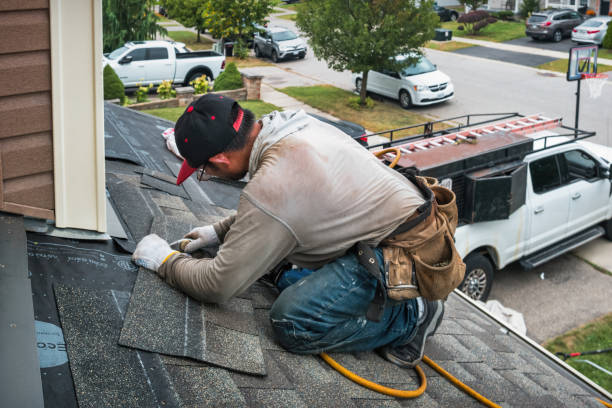 Professional Roofing technician working in Kingsville, MO